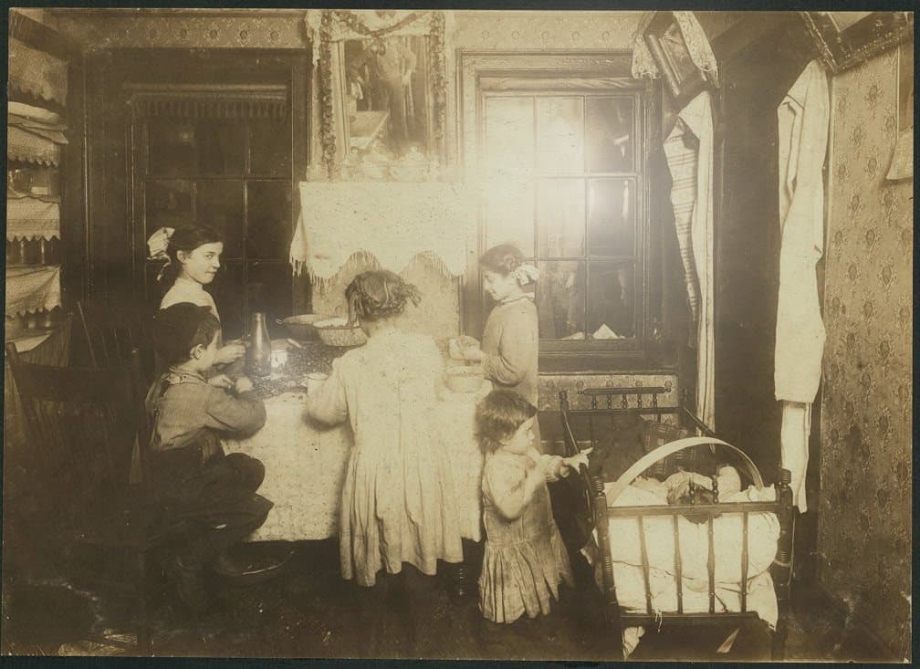 A glossy family print with a glare hotspot from overhead lighting, the most common phone-scanning failure