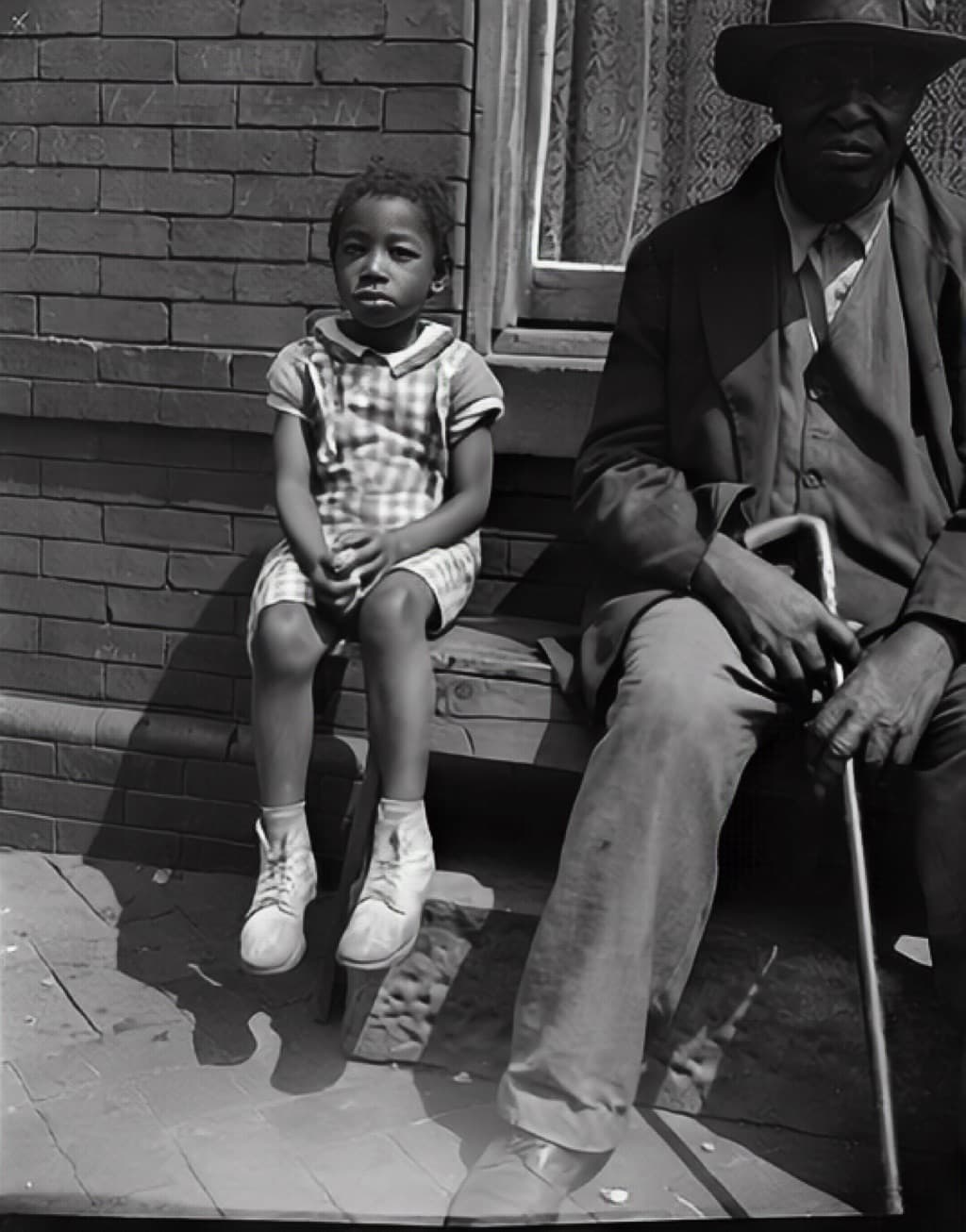Public-domain demonstration photograph of an older man and a child