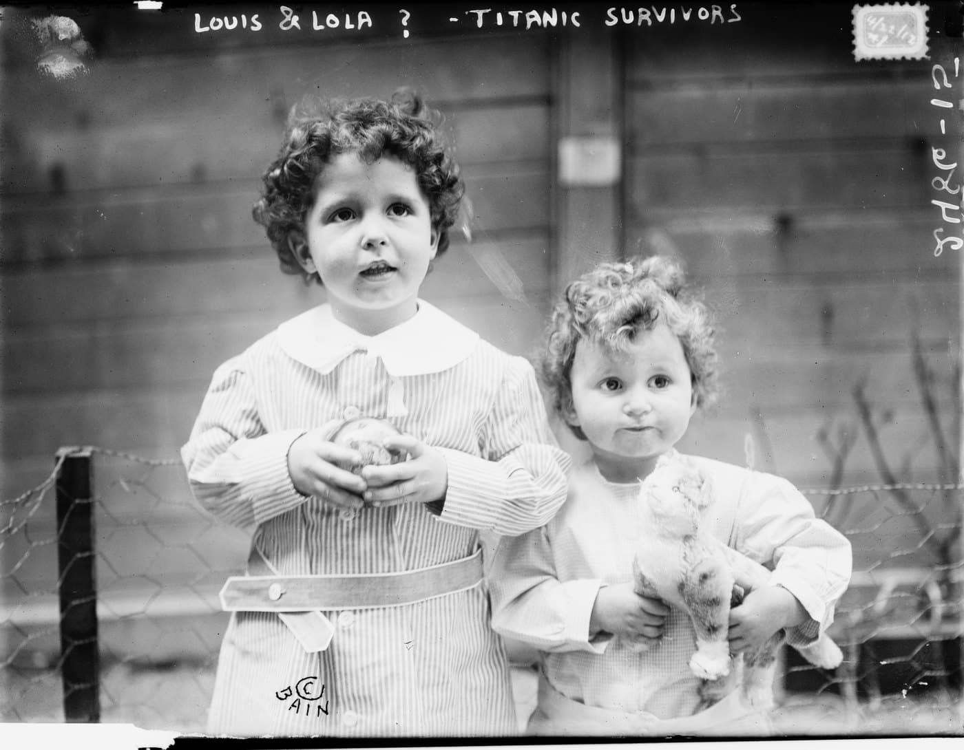 Michel and Edmond Navratil photographed in 1912, with the caption "Louis & Lola ? — Titanic survivors" written across the negative by the news agency
