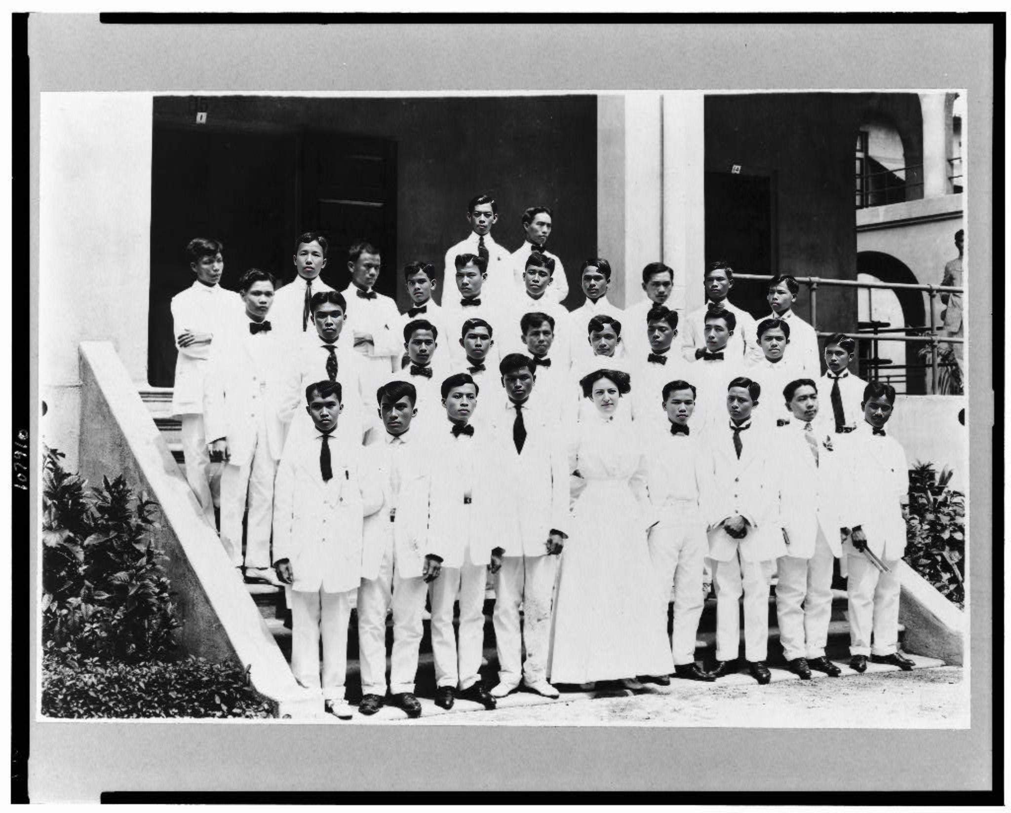 Same group photo with individual faces sharpened and detail recovered